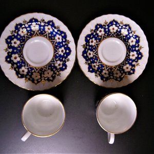 TEA CUPS WITH SAUCERS, SIGNED